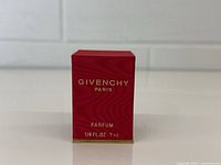 Front view of Givenchy Paris Parfum red box showing brand and volume