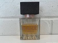 Front view of Rogue perfume bottle with cap on