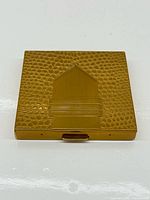 Front view showing textured pattern and central geometric detail