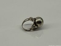 Side view of sterling sphere ring showing openwork shank and sphere top