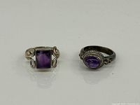 Front view of both sterling rings showing amethyst stones and settings