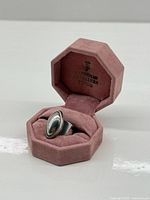Ring in pink octagonal ring box, full view