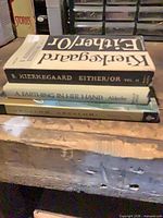 Stacked view of all three book spines on shelf