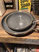 Two Tramontina frying pans nested showing interiors