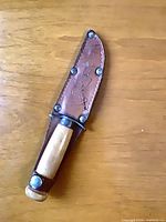 Knife in sheath, full view