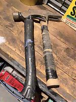 Two hammers on workbench