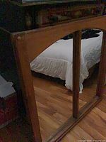 Front view showing full sash with two mirror panels and arched top muntin