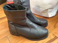 side view of both boots showing uppers, soles and general condition