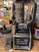 Full view of Ninja Auto-iQ blender base, pitcher and single-serve cup
