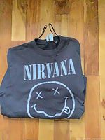 Sweatshirt folded showing Nirvana logo