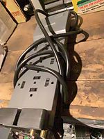 Top view showing six AC outlets and cord