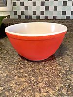 Side view showing red exterior and white interior