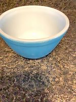 front and interior view of turquoise Pyrex mixing bowl