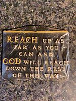 Front view of entire plaque showing text and shrink wrap