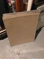 Stack of Lucite sheets with brown paper masking