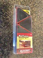 Front view of sealed Milescraft TriGrips package