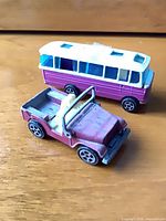 Front side view of both vehicles showing colours and style