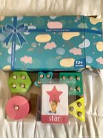 Full view of boxed wooden stack and sort board with shapes visible