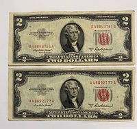 Fronts of both $2 red seal notes showing serials and wear