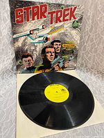 Front sleeve art and vinyl record partially out