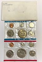 Front of envelope and both red/blue coin sleeves showing obverse of all 12 coins