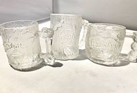 All three Flintstones glass mugs front view