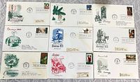 Group shot of all twelve Christmas first day covers laid out in three rows
