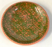 Top view showing combed green slip pattern on plate interior