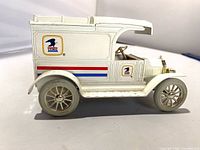 Right side view of Ertl 1913 Model T USPS coin bank showing graphics and overall condition