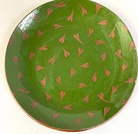 Front view showing green glaze and red heart motifs