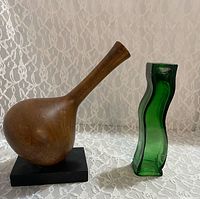Wood vase and green glass holder side by side