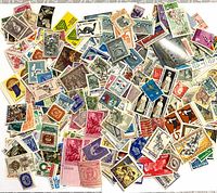 Overhead view of entire loose pile of stamps displaying variety