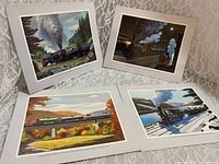 Front view of all four mounted prints displayed