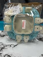 Puzzle feeder sealed in plastic wrap showing overall design