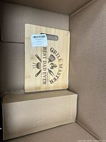 Top view of bamboo cutting board inside shipping carton