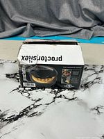 Damaged retail box showing Proctor Silex mini waffle maker