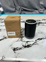 Diffuser beside original box showing overall appearance