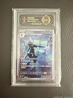 Front view of graded Ceruledge Pokémon card in APH slab