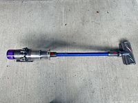 Full view of Dyson V11 Absolute stick vacuum with wand and cleaner head