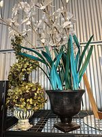 Overview showing both faux plant arrangements on shelf