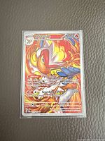 Front view of sleeved Infernape Pokémon card showing stats and artwork