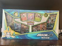 Front view of sealed Jirachi GX Collection box showing all contents