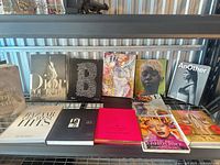 Shelf with twelve fashion and lifestyle books and magazines