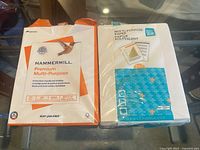 Front view of two sealed printer paper reams