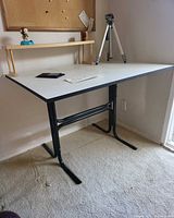 Desk with shelf and tripod overall view