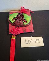 Complete wall hanging showing medallion, cord and tassel