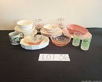 Full lot showing plates, bowls, glasses, platter, mug