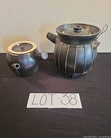 Both stoneware vessels side by side with lot number visible