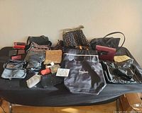 Overall view of all bags and pouches on table
