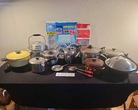 Group shot of all cookware and utensils on table